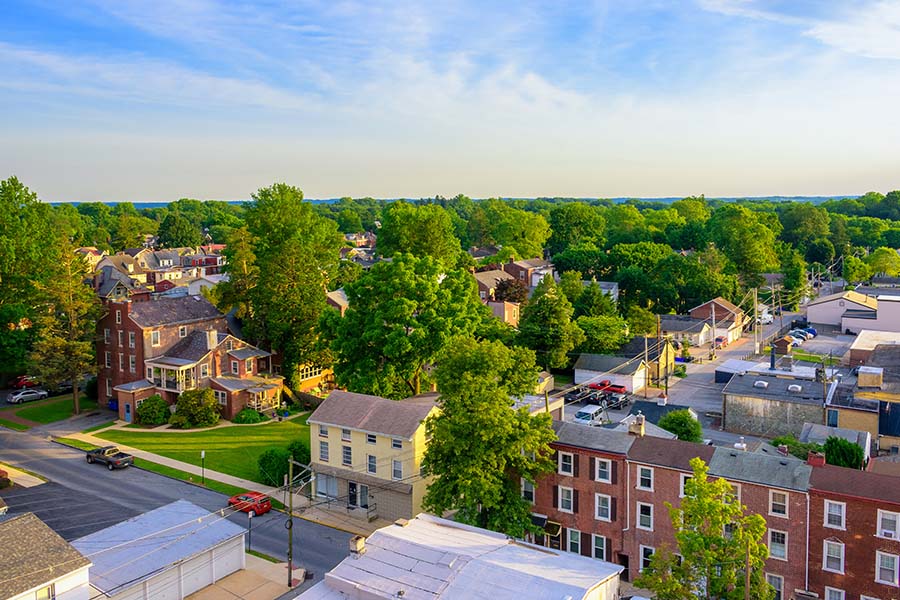 Huntingdon PA - View Of Huntingdon Pennsylvania Neighborhood With Green Trees And Blue Sky
